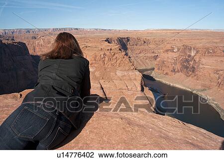 Woman leaning on rock looking at a view, Horseshoe Bend, Glen Canyon National Recreation Area, Arizona-Utah, USA View Large Photo Image Stock Image - Woman leaning on rock looking at a view, Horseshoe Bend, Glen Canyon National Recreation Area, Arizona-Utah, USA. Fotosearch