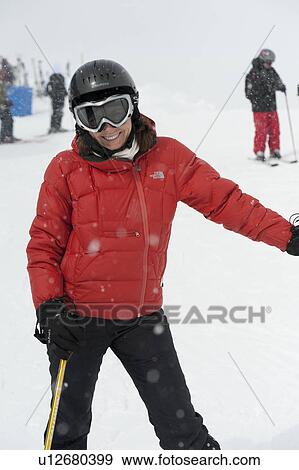 Stock Photo - Woman skiing, Whistler, British Columbia, Canada. Fotosearch