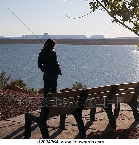 Woman standing at the lakeside, Lake Powell, Glen Canyon National Recreation Area, Arizona-Utah, USA View Large Photo Image Picture - Woman standing at the lakeside, Lake Powell, Glen Canyon National Recreation Area, Arizona-Utah, USA. Fotosearch