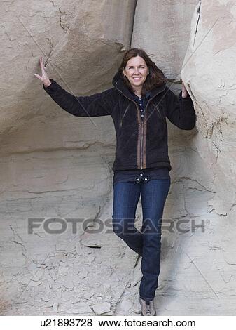 Woman standing in a canyon, Utah, USA View Large Photo Image Stock Photo - Woman standing in a canyon, Utah, USA. Fotosearch