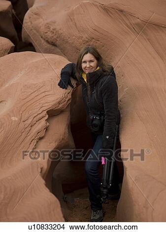 Picture - Woman standing in a slot canyon, Corkscrew Canyon, Lower Antelope Canyon, Antelope Canyon, Page, Arizona, USA. Fotosearch