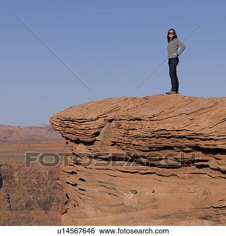 Woman standing on a rock at Horseshoe Bend, Glen Canyon National Recreation Area, Arizona-Utah, USA View Large Photo Image Stock Photograph - Woman standing on a rock at Horseshoe Bend, Glen Canyon National Recreation Area, Arizona-Utah, USA. Fotosearch