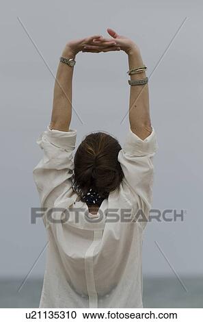 Woman stretching her arms, Sayulita, Nayarit, Mexico View Large Photo Image Stock Image - Woman stretching her arms, Sayulita, Nayarit, Mexico. Fotosearch