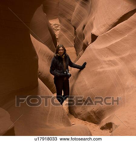 Woman walking in a slot canyon, Corkscrew Canyon, Lower Antelope Canyon, Antelope Canyon, Page, Arizona, USA View Large Photo Image Stock Image - Woman walking in a slot canyon, Corkscrew Canyon, Lower Antelope Canyon, Antelope Canyon, Page, Arizona, USA. Fotosearch