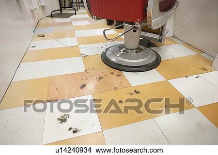 An empty barber shop with cut hair on floor View Large Photo Image Picture - An empty barber shop with cut hair on floor. Fotosearch