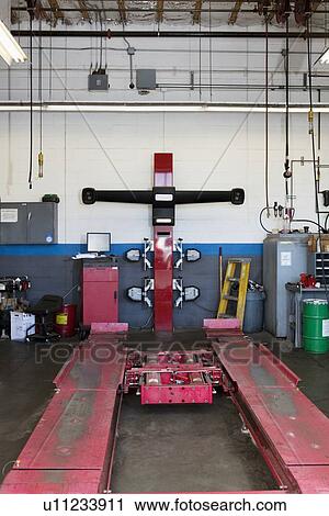 Empty hoist in automobile repair shop View Large Photo Image Stock Image - Empty hoist in automobile repair shop. Fotosearch