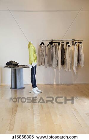 Stock Photography - Interior of a fashionable clothes boutique. Fotosearch