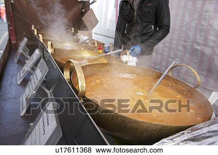 Midsection of a young man cooking Thai food at street stall View Large Photo Image Stock Photo - Midsection of a young man cooking Thai food at street stall. Fotosearch