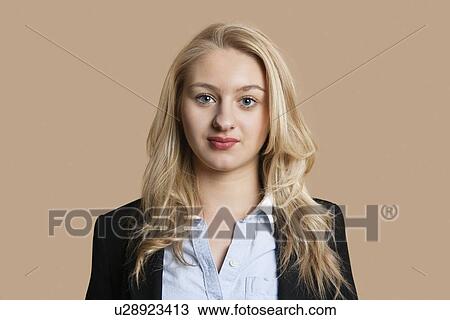 Portrait of a beautiful blond business woman over colored background View Large Photo Image Stock Image - Portrait of a beautiful blond business woman over colored background. Fotosearch