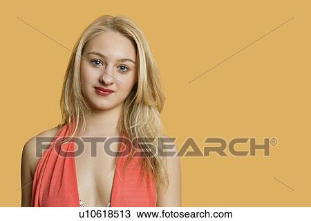 Portrait of a beautiful blond woman over colored background View Large Photo Image Stock Image - Portrait of a beautiful blond woman over colored background. Fotosearch