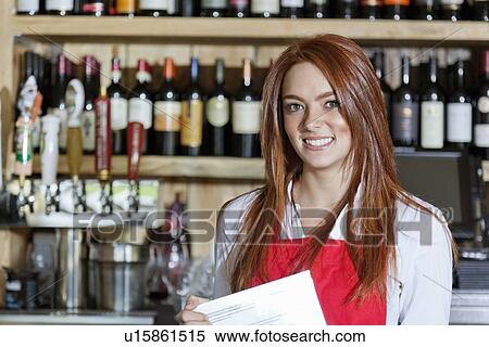 Stock Photography - Portrait of a beautiful young waitress. Fotosearch