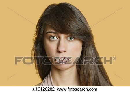 Portrait of a beautiful young woman with sprinkled lips over colored background View Large Photo Image Stock Image - Portrait of a beautiful young woman with sprinkled lips over colored background. Fotosearch