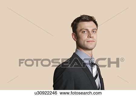 Portrait of a confident mid adult business professional over colored background View Large Photo Image Stock Photograph - Portrait of a confident mid adult business professional over colored background. Fotosearch