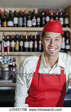 Stock Photo - Portrait of a happy bartender. Fotosearch