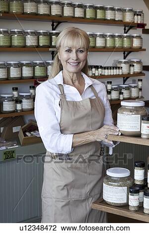 Portrait of a happy senior female employee in spice store View Large Photo Image Stock Image - Portrait of a happy senior female employee in spice store. Fotosearch