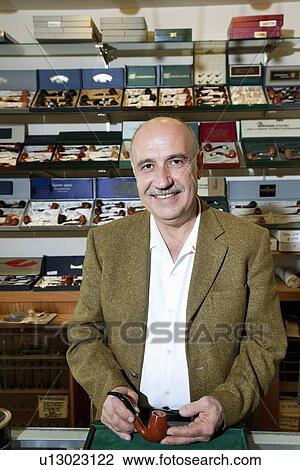 Portrait of a mature tobacco shop owner View Large Photo Image Stock Image - Portrait of a mature tobacco shop owner. Fotosearch
