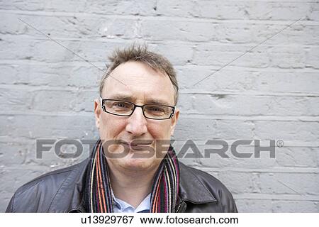 Portrait of a relaxed mature man wearing eyeglasses View Large Photo Image Stock Photo - Portrait of a relaxed mature man wearing eyeglasses. Fotosearch
