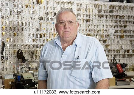Portrait of a senior male owner of key store View Large Photo Image Stock Image - Portrait of a senior male owner of key store. Fotosearch