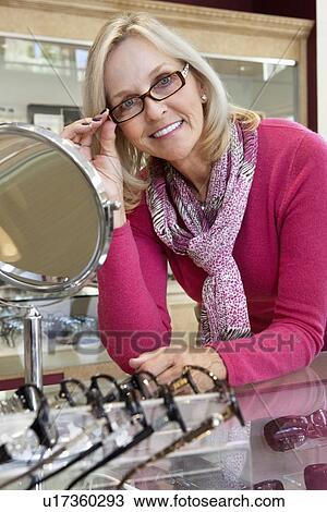 Portrait of a senior woman wearing eyeglasses View Large Photo Image Stock Image - Portrait of a senior woman wearing eyeglasses. Fotosearch