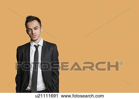 Portrait of a young businessman over colored background View Large Photo Image Stock Image - Portrait of a young businessman over colored background. Fotosearch