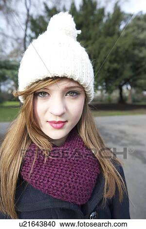 Portrait of beautiful young woman wearing scarf and knit cap View Large Photo Image Stock Image - Portrait of beautiful young woman wearing scarf and knit cap. Fotosearch