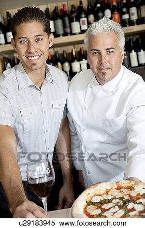 Portrait of happy men with wine glass and pizza View Large Photo Image Stock Photography - Portrait of happy men with wine glass and pizza. Fotosearch