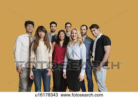 Portrait of happy multiethnic group of friends standing together over colored background View Large Photo Image Stock Image - Portrait of happy multiethnic group of friends standing together over colored background. Fotosearch