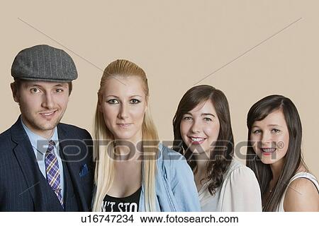 Portrait of young multiethnic friends over colored background View Large Photo Image Picture - Portrait of young multiethnic friends over colored background. Fotosearch