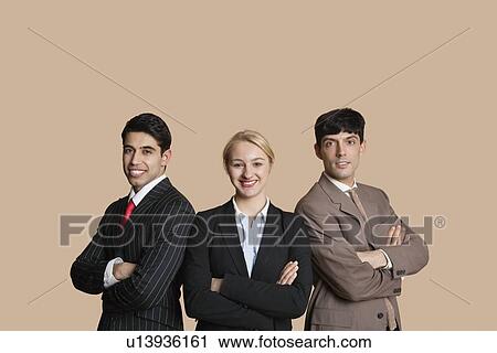 Portrait of young multiethnic team with arms crossed over colored background View Large Photo Image Stock Image - Portrait of young multiethnic team with arms crossed over colored background. Fotosearch