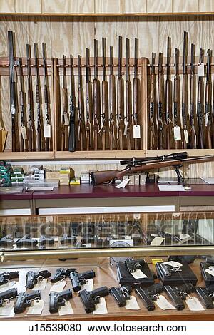 Stock Image - Weapons displayed in gun shop. Fotosearch