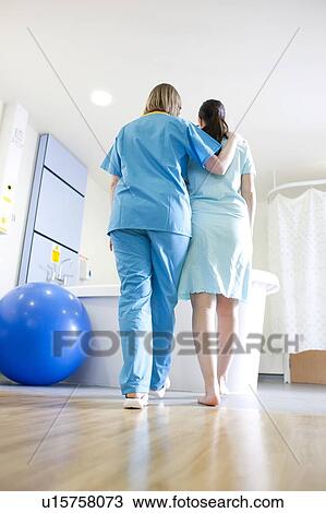Stock Image - Birthing centre. Pregnant woman during early labour at a birthing centre.. Fotosearch