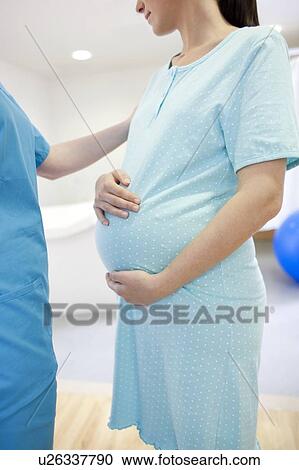 Birthing centre. Pregnant woman during early labour at a birthing centre. View Large Photo Image Stock Image - Birthing centre. Pregnant woman during early labour at a birthing centre.. Fotosearch