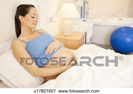 Birthing centre. Pregnant woman in a room at a birthing centre. View Large Photo Image Stock Photo - Birthing centre. Pregnant woman in a room at a birthing centre.. Fotosearch