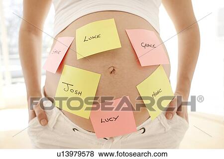 Choosing baby names. View Large Photo Image Stock Photo - Choosing baby names.. Fotosearch