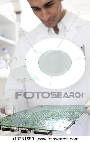 Circuit board manufacture. View Large Photo Image Stock Image - Circuit board manufacture.. Fotosearch