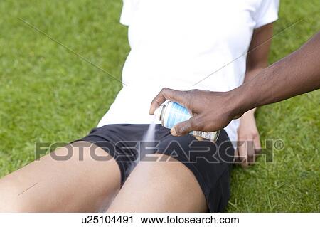 Cramp treatment. Cooling spray being used to treat cramp. View Large Photo Image Stock Image - Cramp treatment. Cooling spray being used to treat cramp.. Fotosearch