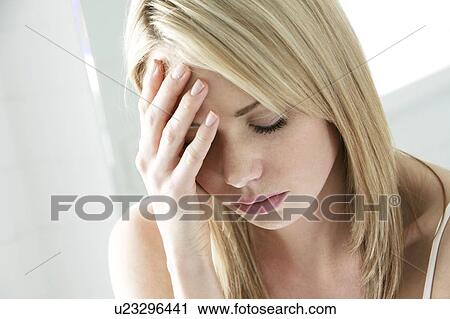 Stock Image - Depressed young woman.. Fotosearch