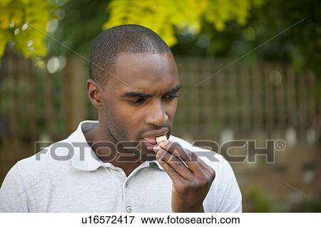 Diabetic taking a glucose tablet. View Large Photo Image Stock Photo - Diabetic taking a glucose tablet.. Fotosearch