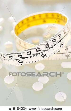 Picture - Diet pills, conceptual image.. Fotosearch