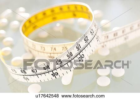 Stock Photo - Diet pills, conceptual image.. Fotosearch