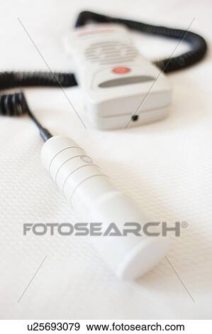 Stock Photo - Doppler monitor. This device is used to listen to a foetus' heartbeat.. Fotosearch