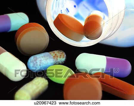 Stock Image - Drugs pouring from a bottle.. Fotosearch