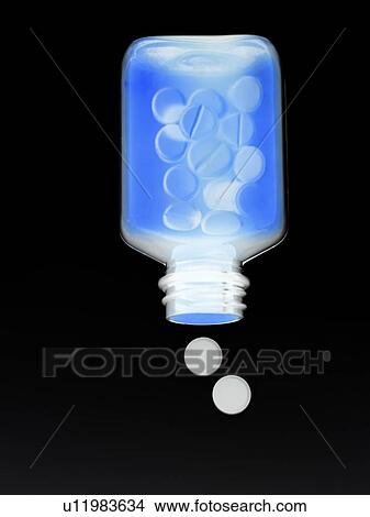 Drugs spilling from a bottle. View Large Photo Image Picture - Drugs spilling from a bottle.. Fotosearch