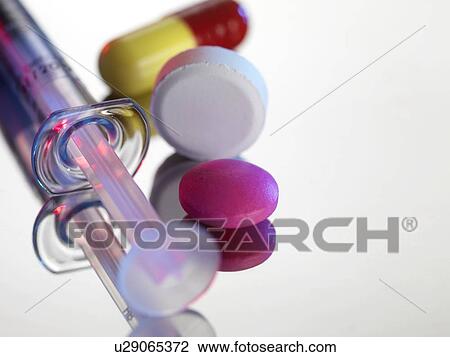 Stock Image - Drugs. Tablets and a syringe. Fotosearch