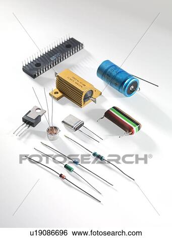 Stock Photograph - Electronic components including resistors, transistors, capacitors and integrated circuits.. Fotosearch