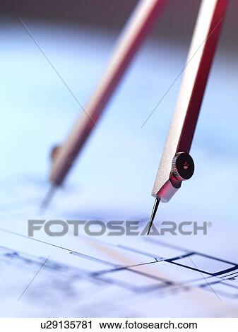 Stock Image - Engineering. Engineer using dividers.. Fotosearch