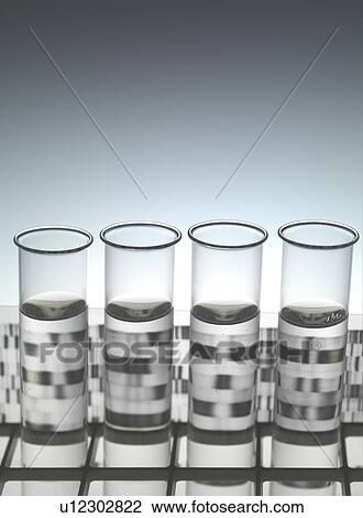 Genetic research. Test tubes sitting in front of a DNA (deoxyribonucleic acid) autoradiogram. View Large Photo Image Stock Image - Genetic research. Test tubes sitting in front of a DNA (deoxyribonucleic acid) autoradiogram.. Fotosearch
