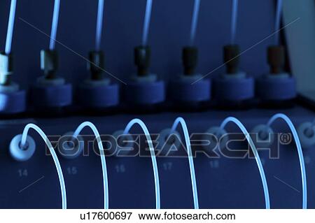Stock Photo - Genome sequencing machine. Close-up of a paired-end module machine used in genome sequencing. Photographed at the Genome Sciences Center, Vancouver, Canada.. Fotosearch
