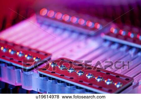 Stock Photo - Genome sequencing machine. Close-up of part of a machine for automated size selection of genome fragments for sequencing. Photographed at the Genome Sciences Center, Vancouver, Canada.. Fotosearch