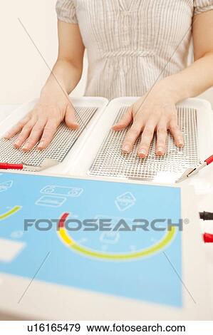 Iontophoresis. This is a treatment for excess sweating of the hands. View Large Photo Image Stock Photo - Iontophoresis. This is a treatment for excess sweating of the hands.. Fotosearch
